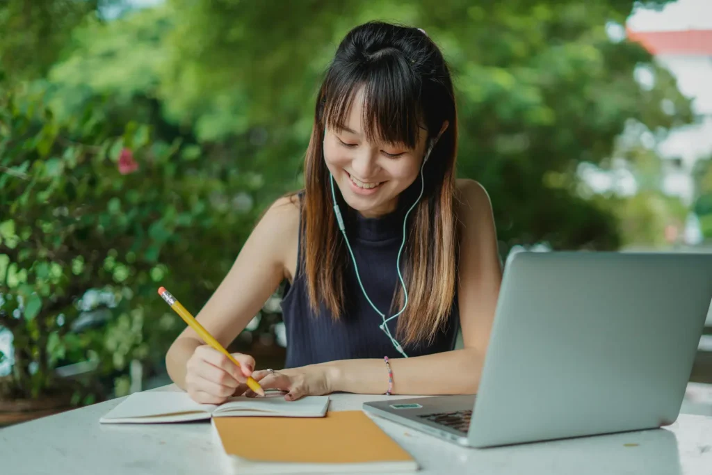 A lady enjoying working inside a cafe space